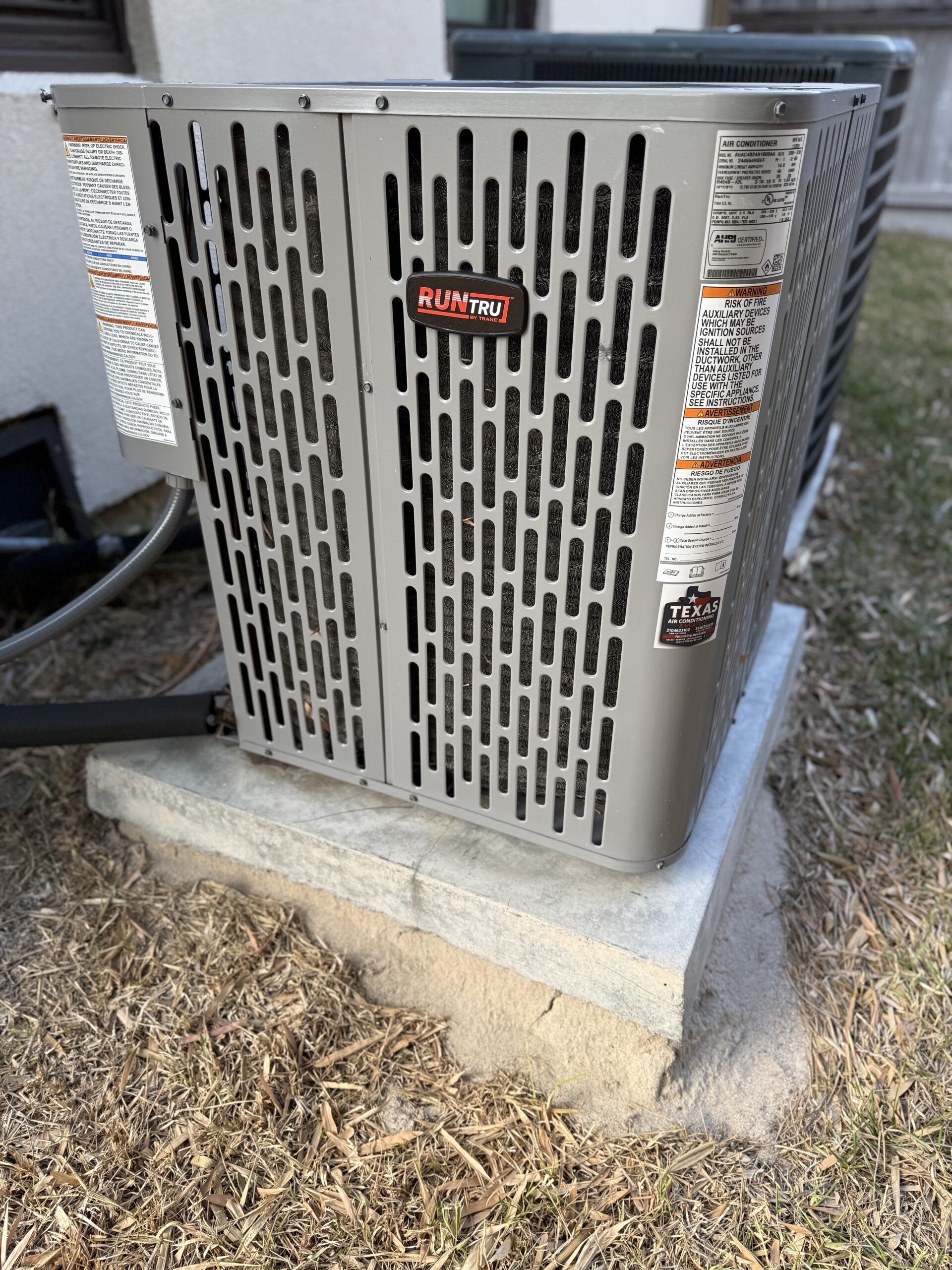 Outdoor AC condenser replacement setup at a San Antonio property