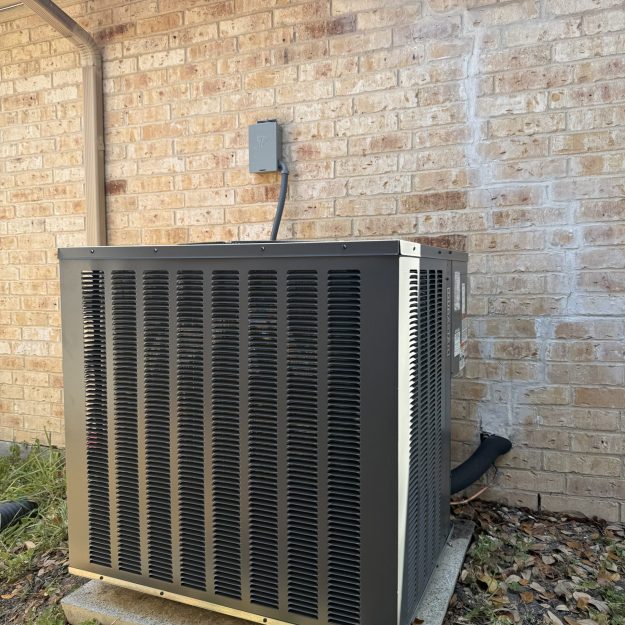 New outdoor AC condenser installation at a San Antonio home